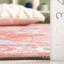 Tapis de style sud-ouest en coton / chenille lavable à la machine en rouille / bleu Wassay-1159984008