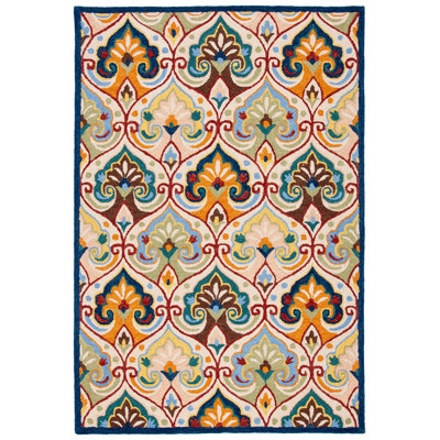 Metro Hand Tufted Wool/Cotton Floral Rug in Beige/Blue