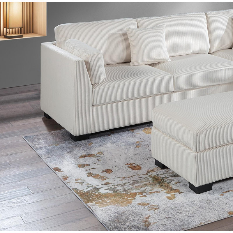 Sectional sofa with chaise longue and footstool