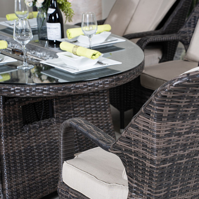 Emilie 6 - Person Patio Dining Set Oval Table with Cushions Included