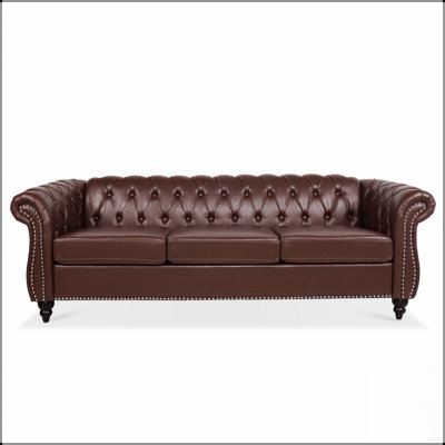 Canapé Chesterfield en polyuréthane à trois places avec accoudoirs roulés et dossier capitonné classique, pour une décoration intérieure élégante