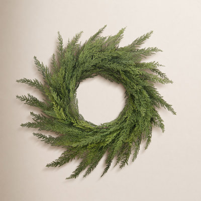 28" Green Cedar Wreath. This green cedar wreath showcases a lush, full design with rich, realistic foliage, bringing a timeless touch of nature to your door or space, perfect for adding warmth and charm to any seasonal display.