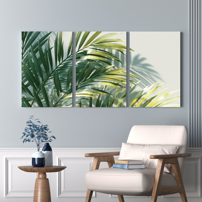 Ensemble de 3 tableaux sur toile tendue représentant des feuilles de palmier tropicales et reflétant la nature