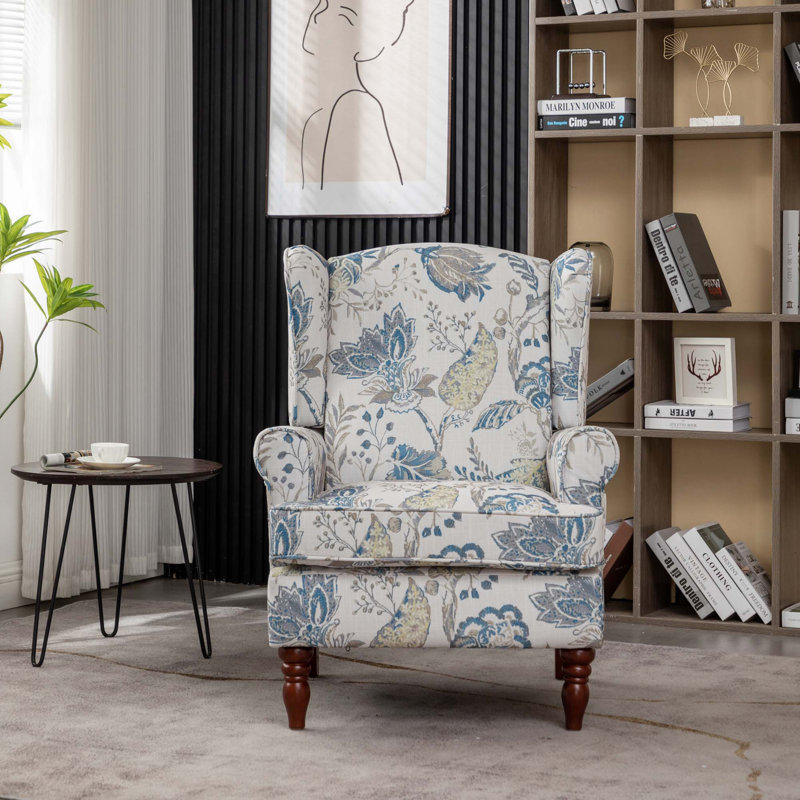 Fauteuil à oreilles moderne avec revêtement floral et pieds en bois massif