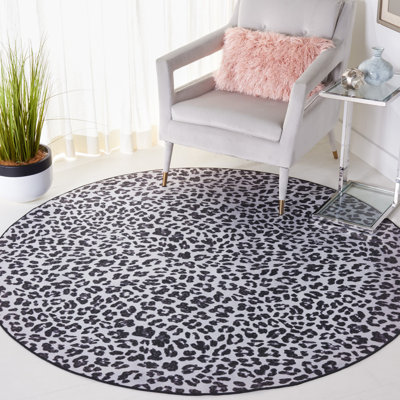 Tapis à imprimé animal ivoire / noir