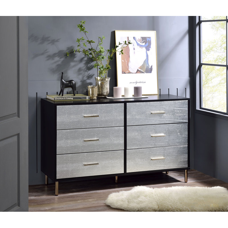 Commode noire, argentée et dorée