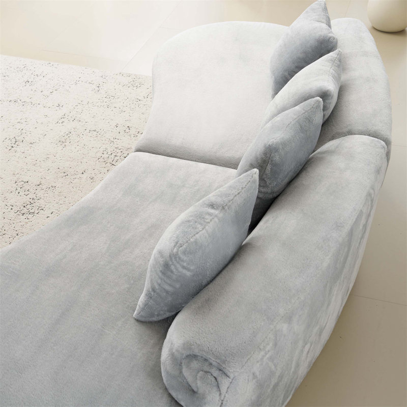 Canapé incurvé innovant et confortable en flanelle multicolore avec coussins, idéal pour se détendre et socialiser dans le salon