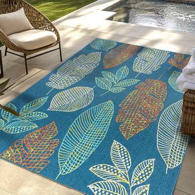 Tapis d'intérieur / extérieur en polypropylène tissé à plat à feuilles tropicales multicolores bleu marine Collmar Sway