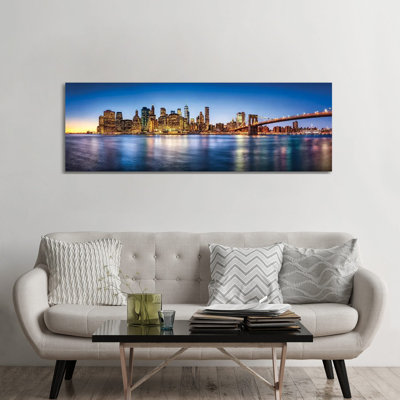 Manhattan Skyline Panorama With Brooklyn Bridge by Jan Becke - Wrapped Canvas Panoramic Print