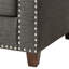 Chaise à accoudoirs évasés gris anthracite avec coussins décoratifs et garniture élégants
