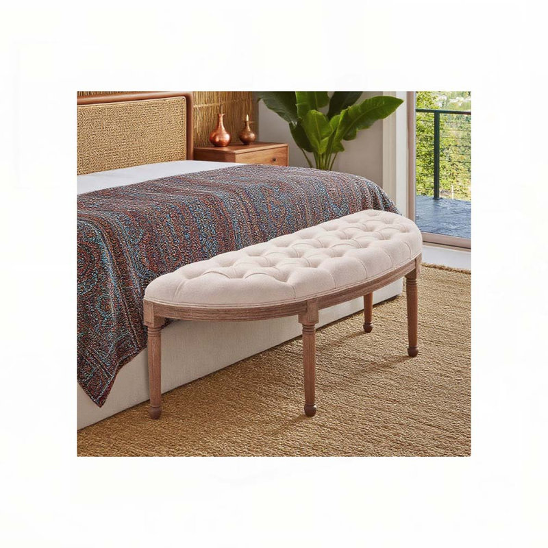 Banc de bout de lit tapissier à l'extrémité du lit