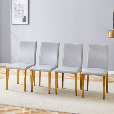 Quatre chaises de salle à manger en polyuréthane gris clair, simples et polyvalentes, confortables et accompagnées. Des chaises de salle à manger exquises et polyvalentes offrent une nouvelle expérience confortable. (Ensemble de 4)