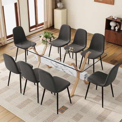 Table de salle à manger en verre trempé transparent de 71 po x 35,4 po avec 8 chaises en tissu de lin gris foncé, conception ergonomique réfléchie pour une longue structure en bois