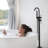 Solid Brass Floor Mount Tub Filler - Matte Black With Handheld Shower Function Freestanding Faucet Construction-117432632