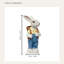 Statue de lapin de jardin en salopette bleue