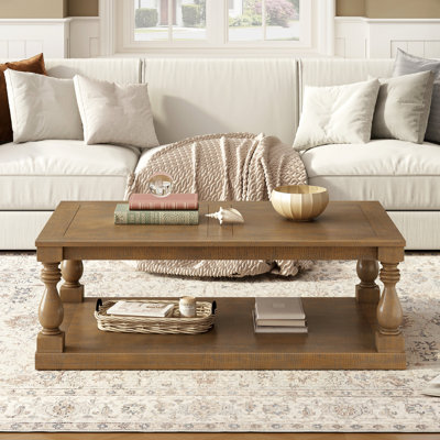 Table basse rétro avec pieds en colonne de style artistique et placage Armontae luxueux pour un charme intemporel, convenant au salon et à la salle d'étude
