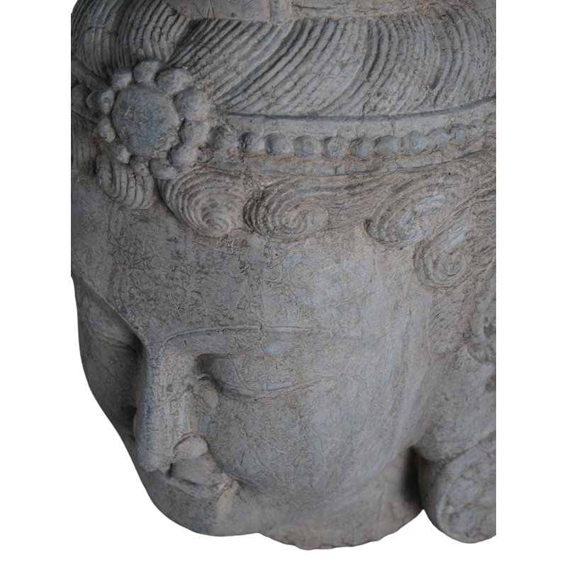 A Stone Statue Of Guanyin Head