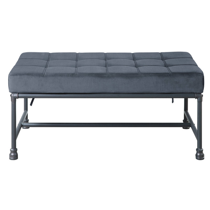 Banc de chambre en velours gris avec pieds industriels et design industriel capitonné pour