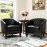 Fauteuil demi-tonneau capitonné en similicuir noir Edvardas