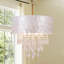 Lustre cylindrique à 4 lumières à intensité variable avec accents de cristal Capiz