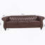Canapé Chesterfield en polyuréthane à accoudoirs roulés.-114427253