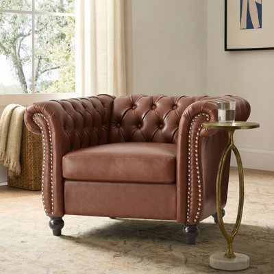 Fauteuil club avec accoudoirs à volutes
