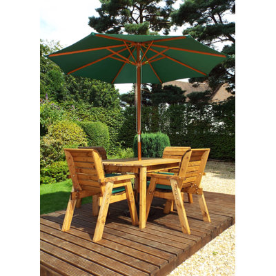 Feldman 4 - Person Wood Patio Dining Set with Rectangular Table , Cushions Included