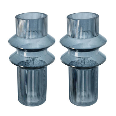 Set Of Two Fluted Glass Accent Vases With Ribbed Texture, Cylindrical Shape, Smoked Blue Finish, And Versatile Decorative Functionality.