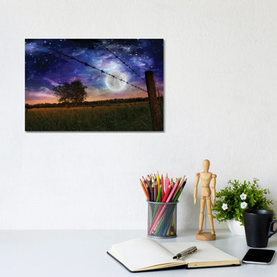 Starry Night With Bright Moon And Farmers Fence In The Field by Bruce Rolff - Wrapped Canvas Print
