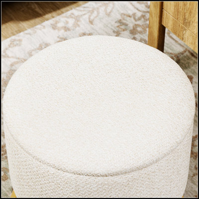 Repose-pieds rond avec rangement rembourré, parfait pour le rangement caché et les sièges confortables dans tout espace de vie.