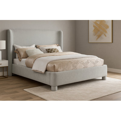 Hridhaan Upholstered Unfinished Wingback Bed