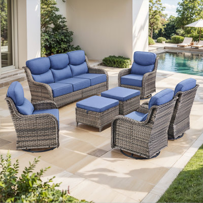Meriline 7-Piece Outdoor Wicker Patio Conversation Set With 4 Swivel Gliders And Ottomans