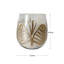 Bougie parfumée à motif de feuilles