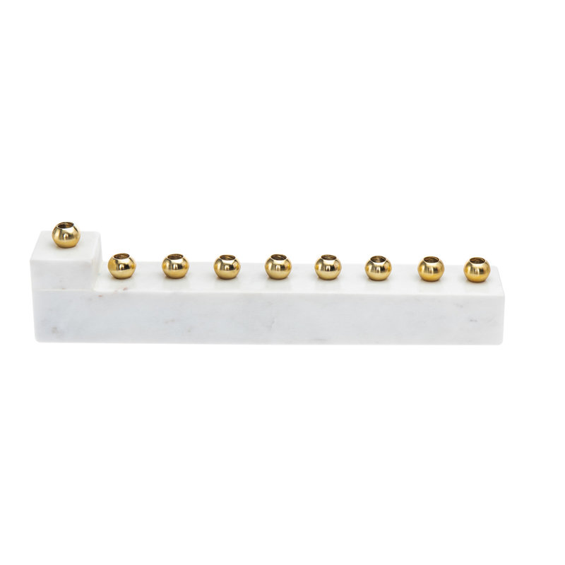 A white minimalist menorah with nine circular gold candle slots