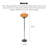 A Bauhaus-style egg tart-shaped iron and glass floor lamp