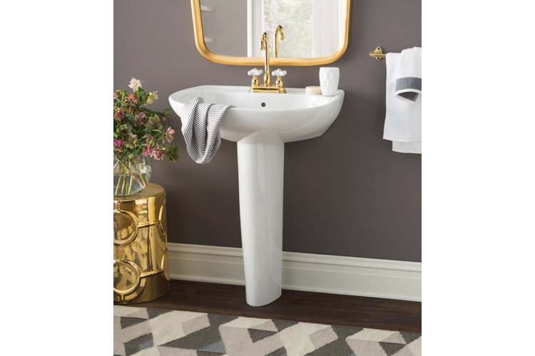 half bathroom with bronze finishes