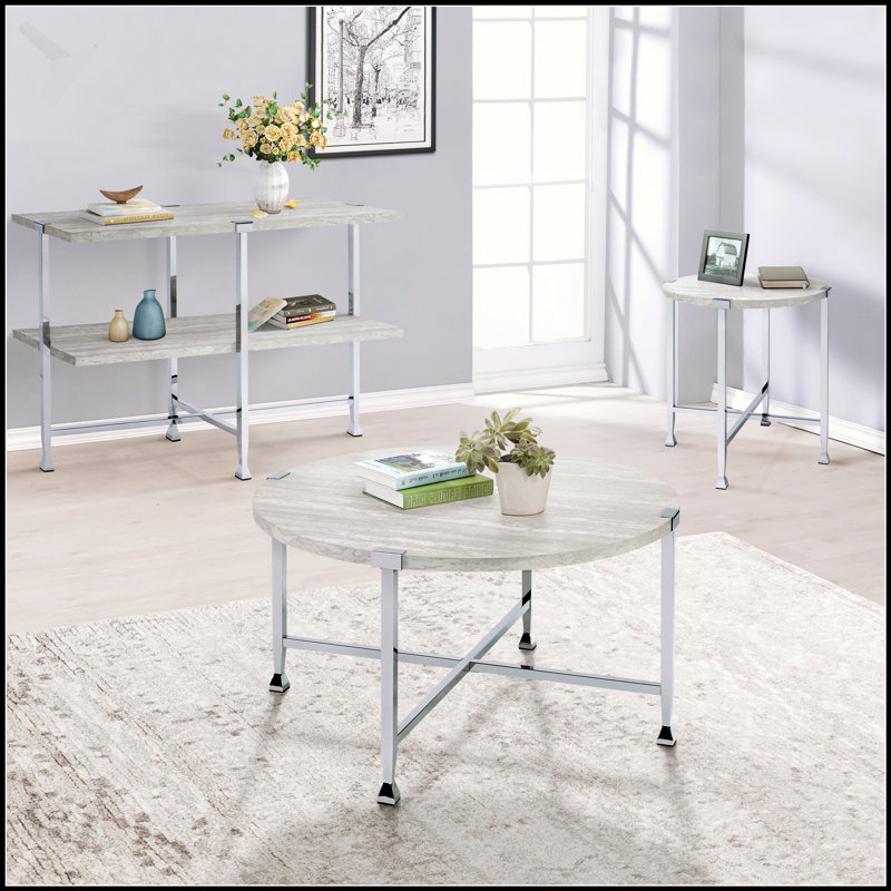 Table basse ronde en chêne blanc et chrome, élégance moderne et charme industriel pour les espaces de vie contemporains.