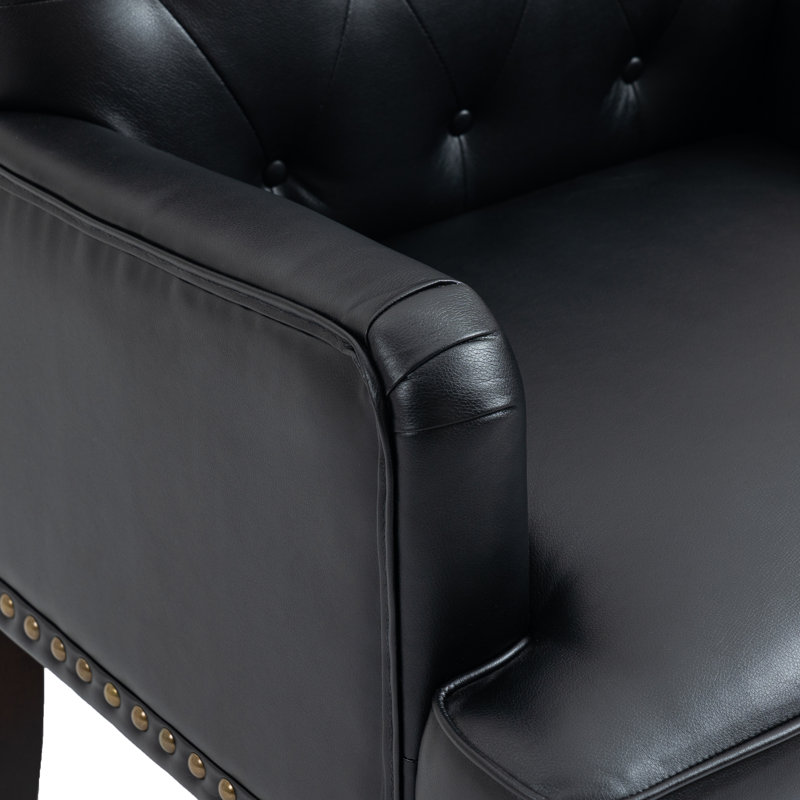 Fauteuil en similicuir noir capitonné Annalese, Noir