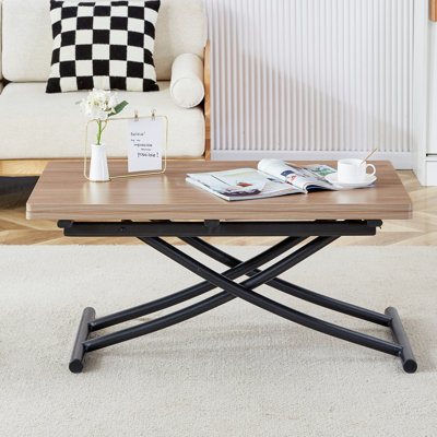 La table de levage moderne et minimaliste multifonctionnelle, avec un bureau autocollant de grain de bois de 0,8 pouce et des pieds en métal noir, peut être utilisée comme coiffeuse, table basse, table de salle à manger et table de bureau