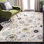 Tapis ivoire / bleu d'intérieur/extérieur à motif floral Doyle-204207343