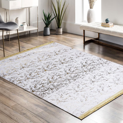 Tapis blanc en peluche à motif floral doré