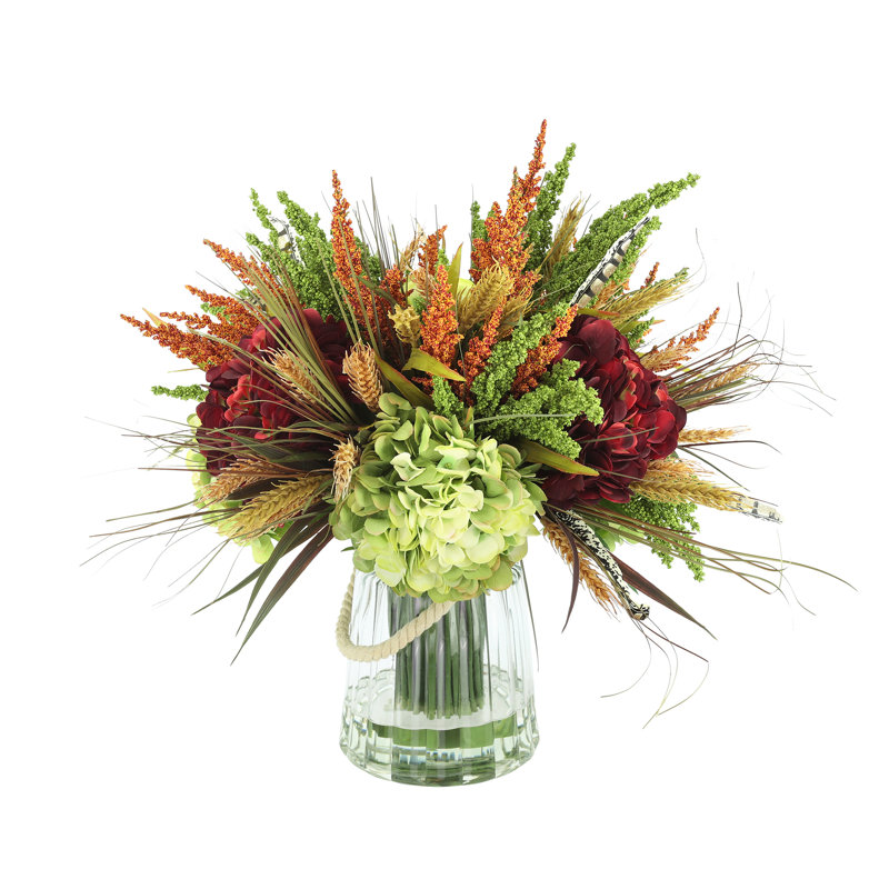 Assortiment artificiel en soie / arrangement en plastique dans un vase en verre