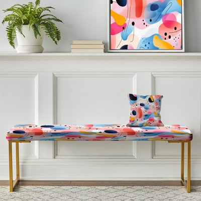 Banc rembourré géométrique doré