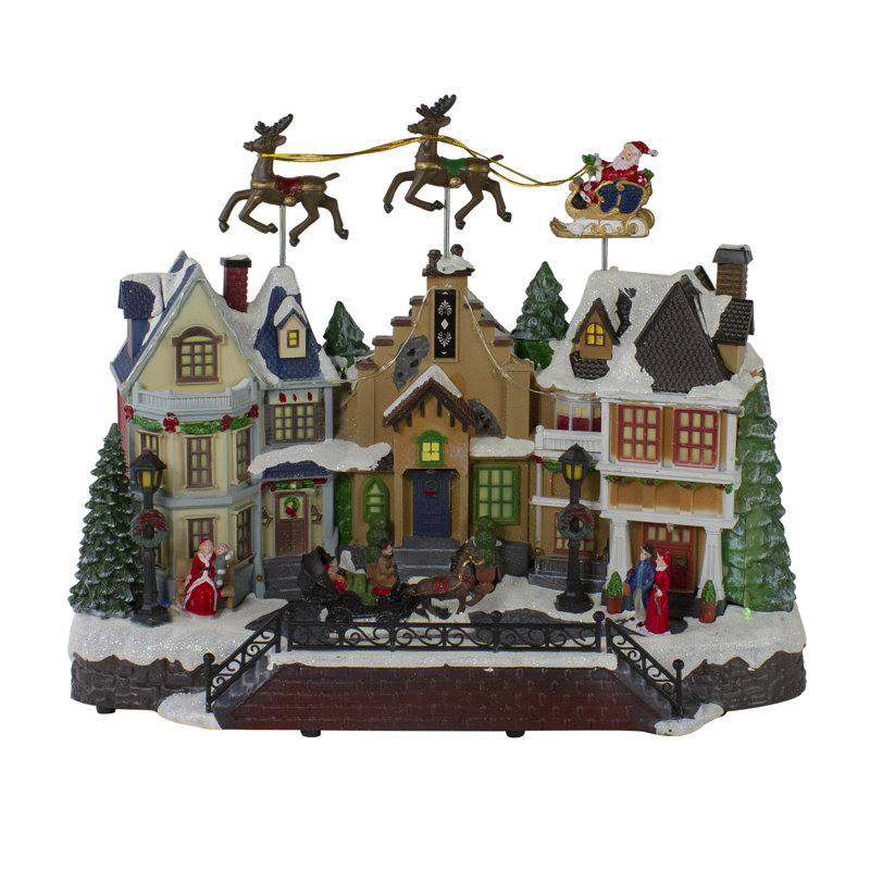 16" White and Brown LED Lighted and Animated Christmas Village with Flying Sleigh Tabletop Decor
