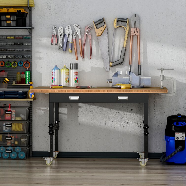https://assets.wfcdn.com/im/19246361/resize-h755-w755%5Ecompr-r85/1535/153528439/Eli+Wood+Top+Height-Adjustable+Workbench+with+Wheels.jpg