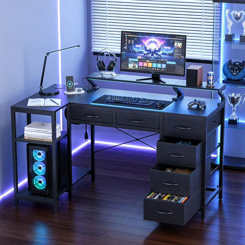 Bureau de jeu en L réversible avec station de charge, support pour écran réglable et tablettes de rangement, bureau d'ordinateur pour bureau à domicile avec éclairage DEL