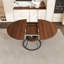 Table de salle à manger ronde extensible avec tablette de rangement, placage de noyer et métal noir mat, s'étend de 43 à 59 pouces, sièges 4-6
