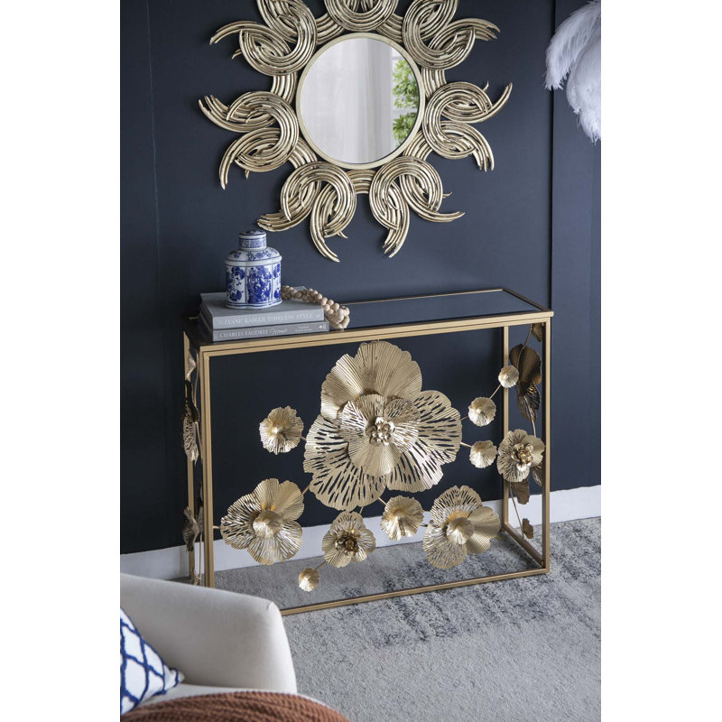 Élégante console dorée avec plateau en verre miroitant, parfaite pour les vestibules modernes et les salons