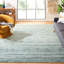 Tapis turquoise / ivoire en laine tissée à la main Pecktonville-78163641