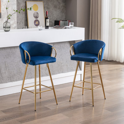 Luxurious Velvet Bar Stools With Golden Legs And Footrest, Perfect For Stylish Seating And Relaxation.